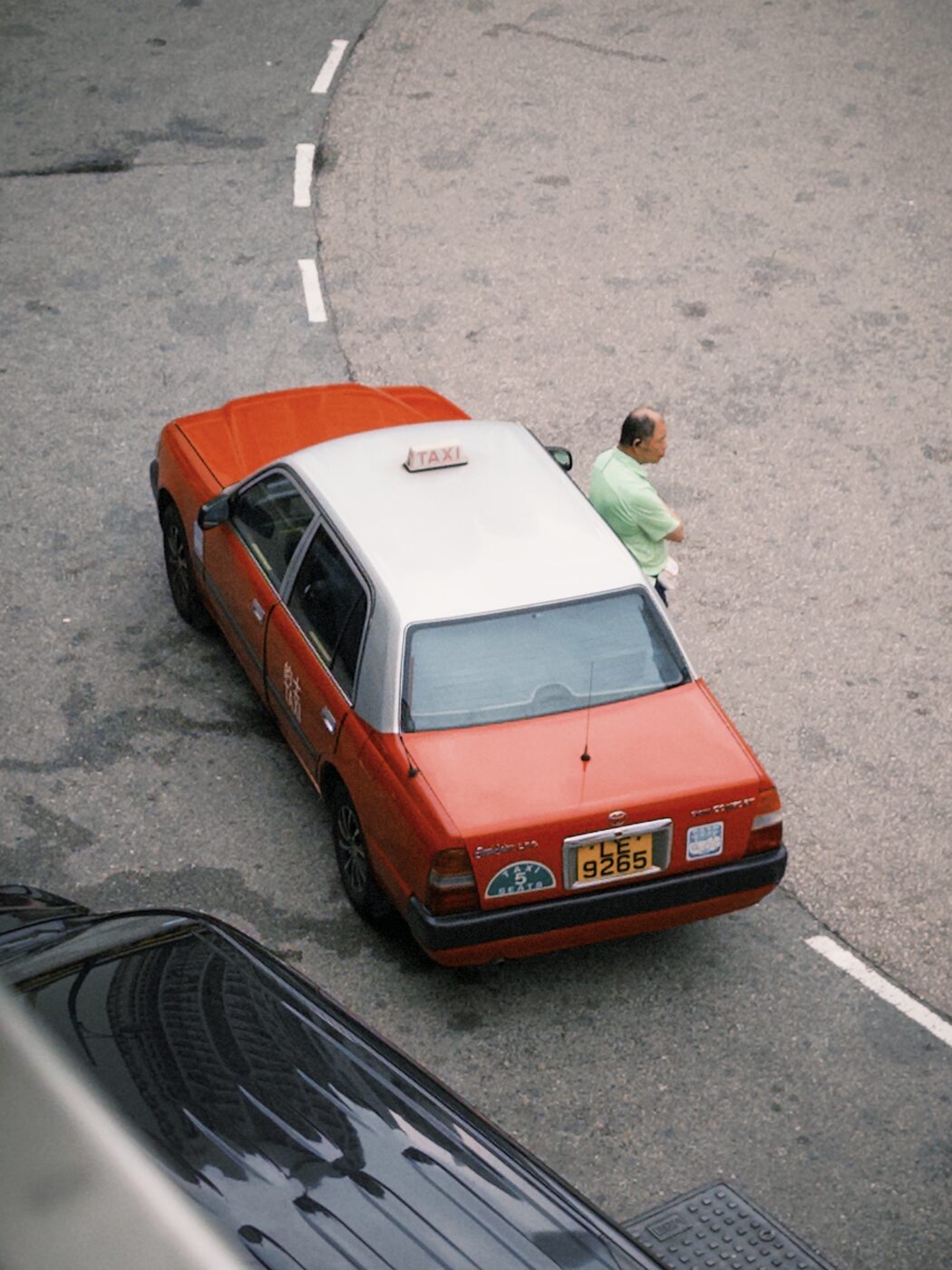 A red Hong Kong taxi seen from above
